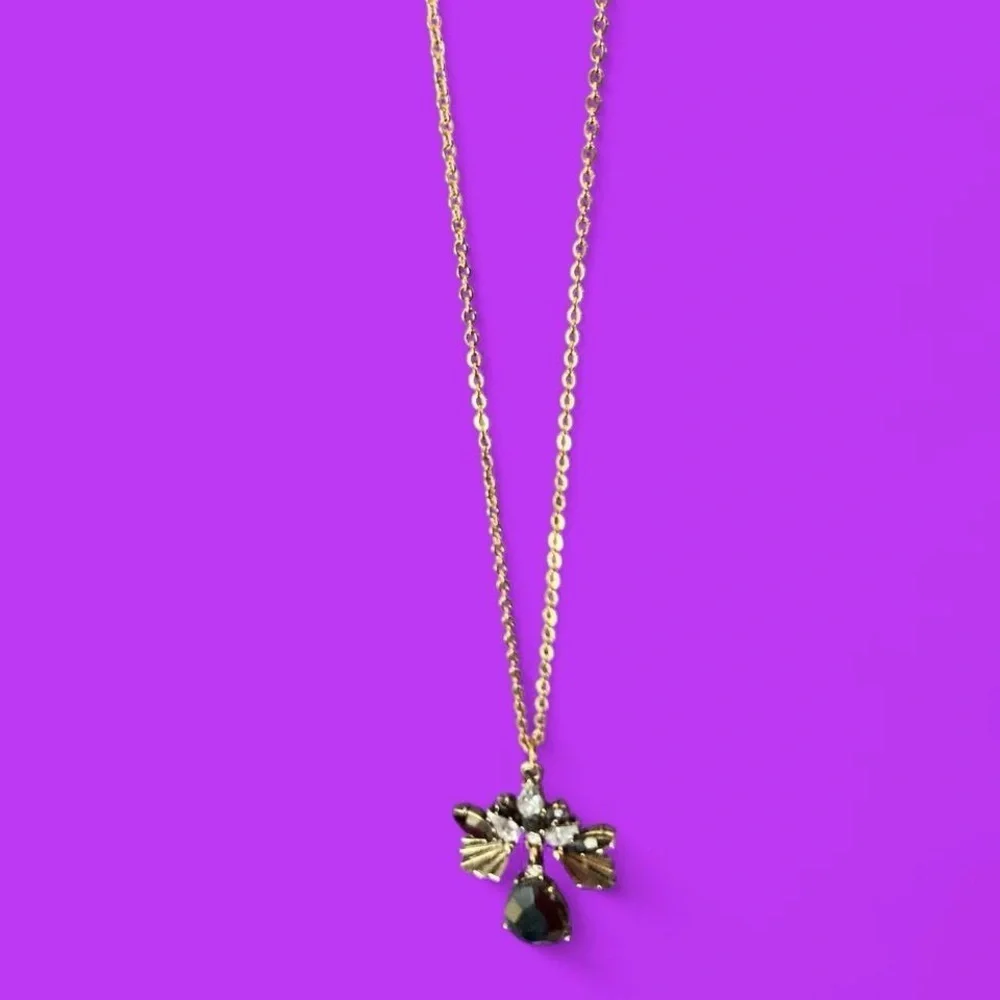 Goldtone rhinestone necklace w black glass gem flower bee style pendant